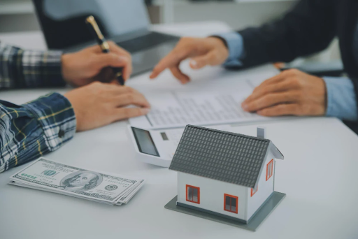 Mortgage Broker Discussing Loan Options with Homebuyer at Office Desk